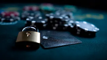 A laptop glowing with a bright login prompt in a minimalistic setup, symbolizing the protected access system at 10WIM.